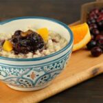 Slow cooked creamy oatmeal with cranberry orange compote