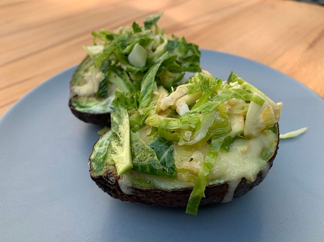 Avocado baked eggs with Brussel sprout salad