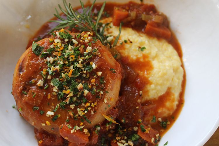 Creamy polenta topped with turnip osso bucco and pistachio gremolata